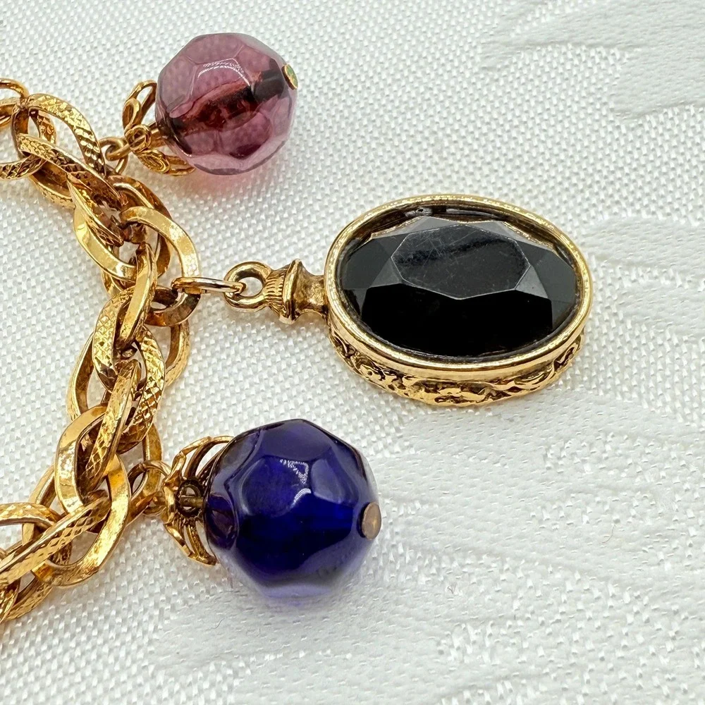 Vintage Gold Tone Charm Bracelet w/ Fleur de Lis, Ring, and Faceted Glass Beads